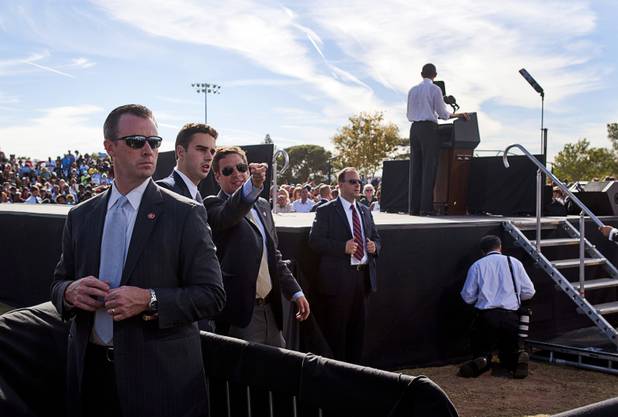 Secret Service Agents keep watch as President Barack Obama speaks during at a campaign rally at the Cheyenne Sports Complex near the College of Southern Nevada in North Las Vegas Thursday, Nov. 1, 2012.