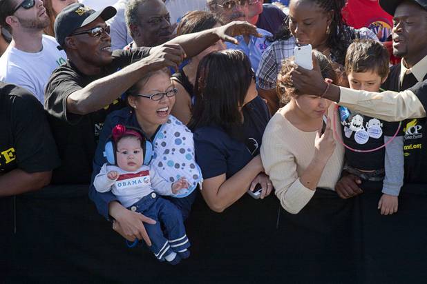 Kim Luong Velazquez holds her four-month-old daughter Emily Lan Velazquez while waiting to meet President Barack Obama during at a campaign rally at the Cheyenne Sports Complex near the College of Southern Nevada in North Las Vegas Thursday, Nov. 1, 2012.