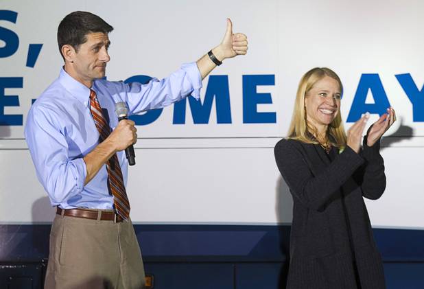 Republican vice presidential candidate Paul Ryan gives a thumbs up to supporters during a campaign stop in Las Vegas Thursday Nov. 1, 2012. Ryan's wife Janna is at right.