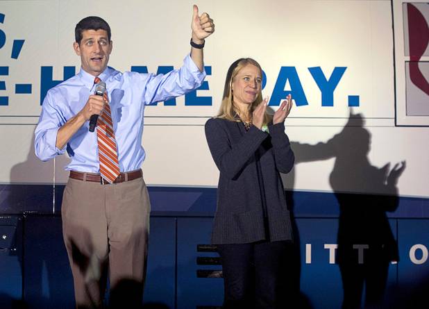 Republican vice presidential candidate Paul Ryan gives a thumbs up to supporters during a campaign stop in Las Vegas Thursday Nov. 1, 2012. Ryan's wife Janna applauds at right.