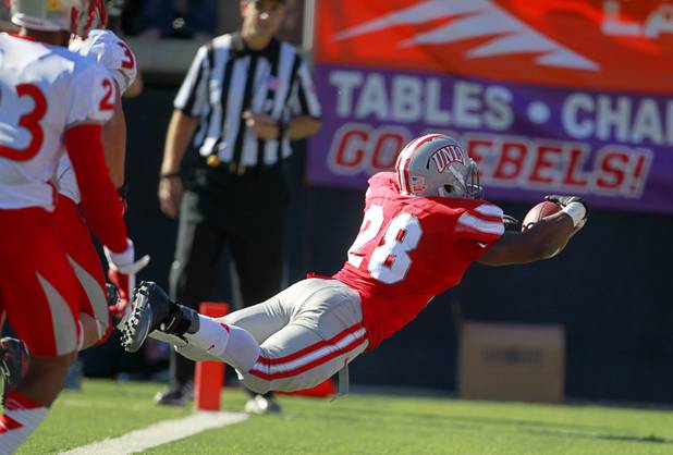 Running back Bradley Randle leaps across the goal line for UNLV's third touchdown in the first half of the Rebels' game against New Mexico at Sam Boyd Stadium on Saturday, Nov. 3, 2012.