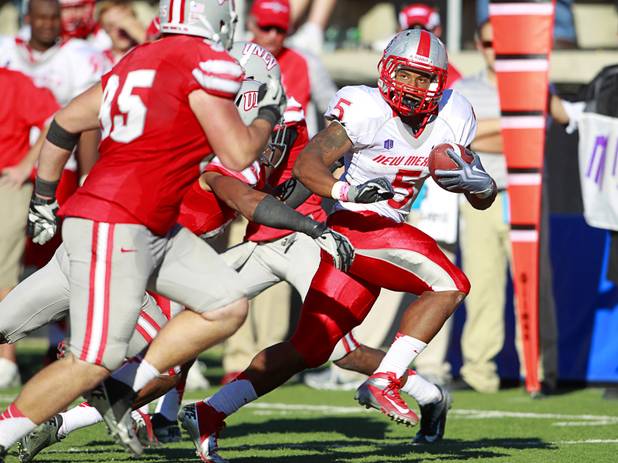 New Mexico's Demarcus Rogers makes a run toward the end zone but is stopped short by the UNLV defense during their game at Sam Boyd Stadium Saturday, Nov. 3, 2012.