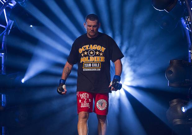 Heavyweight Devin Cole of Medford, Ore. makes his entrance during the World Series of Fighting debut at the PH Live theater at Planet Hollywood Saturday, Nov. 3, 2012. The event was broadcast live on the NBC Sports Network.