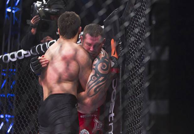 Heavyweight Andrei Arlovski of Belarus pushes Devin Cole of Medford, Ore. against the cage during the World Series of Fighting debut at the PH Live theater at Planet Hollywood Saturday, Nov. 3, 2012. The event was broadcast live on the NBC Sports Network.
