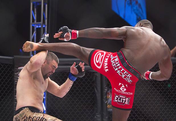 DJ Linderman, left, of Yreka, Calif. blocks a kick from Anthony Johnson of Boca Raton, Fla. during the World Series of Fighting debut in the PH Live theater at Planet Hollywood Saturday, Nov. 3, 2012. The event was broadcast live on the NBC Sports Network.