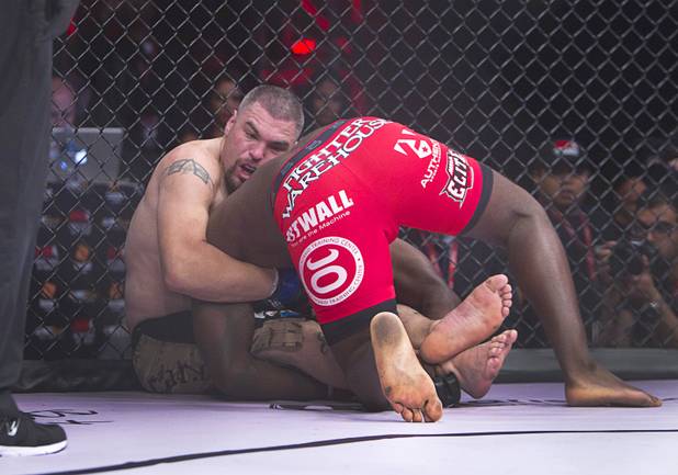 DJ Linderman, left, of Yreka, Calif. grapples with Anthony Johnson of Boca Raton, Fla. during the World Series of Fighting debut in the PH Live theater at Planet Hollywood Saturday, Nov. 3, 2012. The event was broadcast live on the NBC Sports Network.