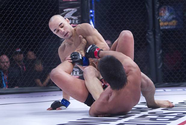 Marlon Moraes, left, of Jupiter, Fla. grapples with Miguel Torres of Chicago during the World Series of Fighting debut in the PH Live theater at Planet Hollywood Saturday, Nov. 3, 2012. The event was broadcast live on the NBC Sports Network.