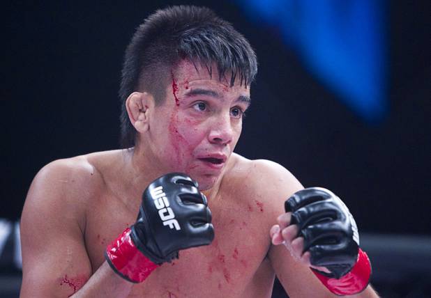 Miguel Torres of Chicago bleeds from a cut on the head while fighting Marlon Moraes of Jupiter, Fla. during the World Series of Fighting debut in the PH Live theater at Planet Hollywood Saturday, Nov. 3, 2012. The event was broadcast live on the NBC Sports Network.