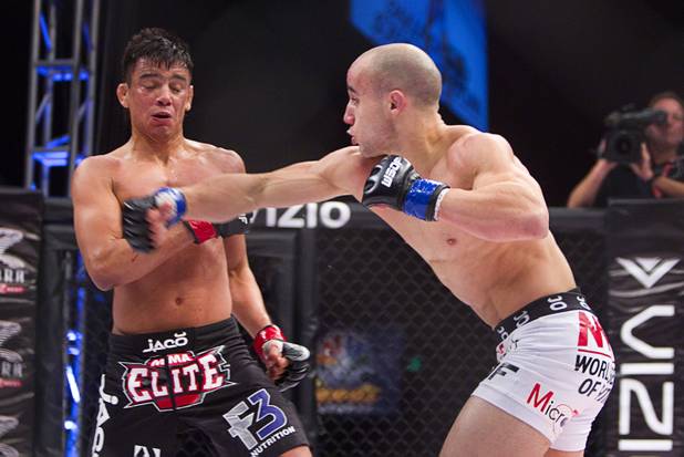 Marlon Moraes, right, of Jupiter, Fla. lands a punch on Miguel Torres of Chicago during the World Series of Fighting debut in the PH Live theater at Planet Hollywood Saturday, Nov. 3, 2012. The event was broadcast live on the NBC Sports Network.