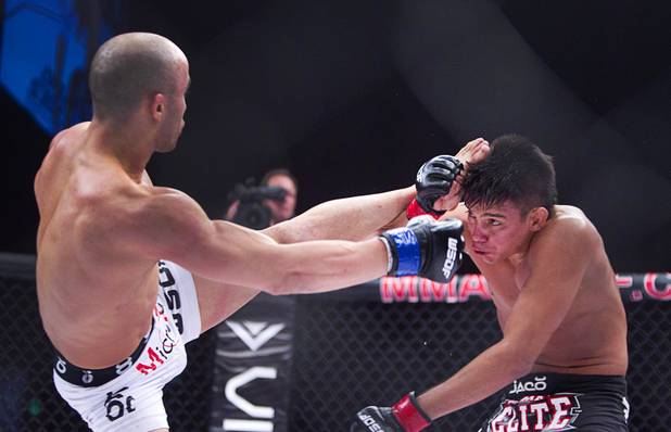 Miguel Torres, right, of Chicago blocks a kick from Marlon Moraes of Jupiter, Fla. during the World Series of Fighting debut in the PH Live theater at Planet Hollywood Saturday, Nov. 3, 2012. The event was broadcast live on the NBC Sports Network.