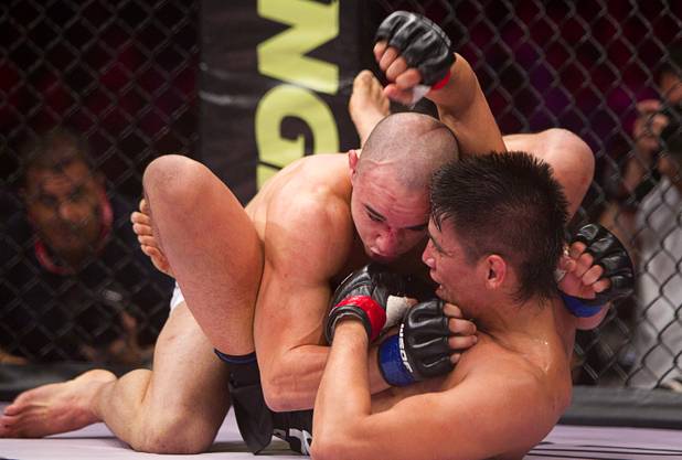 Marlon Moraes, left, of Jupiter, Fla. grapples with Miguel Torres of Chicago during the World Series of Fighting debut in the PH Live theater at Planet Hollywood Saturday, Nov. 3, 2012. The event was broadcast live on the NBC Sports Network.