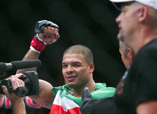 Tyrone Spong of Juper, Fla. celebrates his win over Travis Bartlett of Maine during the World Series of Fighting debut in the PH Live theater at Planet Hollywood Saturday, Nov. 3, 2012. The event was broadcast live on the NBC Sports Network.