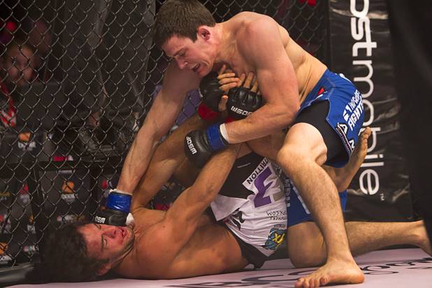 Tyson Steele, right, of Canada lands a punch on Gregor Gracie of New York City during the World Series of Fighting debut in the PH Live theater at Planet Hollywood Saturday, Nov. 3, 2012. The event was broadcast live on the NBC Sports Network.