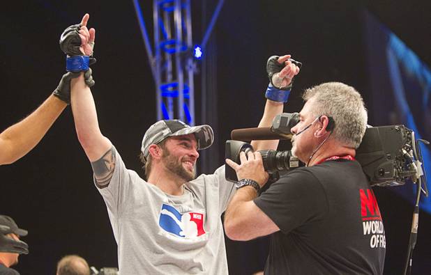 Brian Cobb of Honolulu celebrates his win over Rony Torres of Brazil during the World Series of Fighting debut in the PH Live theater at Planet Hollywood Saturday, Nov. 3, 2012. The event was broadcast live on the NBC Sports Network.