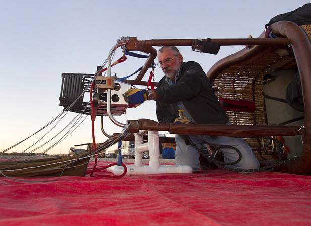 Glen Oelrich of the Split Paint Hot Air Balloon Team, hooks up a propane burner during the Friends of Metro Search and Rescue Las Vegas Balloon Festival and carnival at the Southern Hills Hospital campus on West Sunset Road Sunday, Nov. 4, 2012.  Festival proceeds from the balloon rides will benefit the nonprofit organization that helps support members of the Las Vegas Police Department Metro Search and Rescue section, many of whom are volunteers.