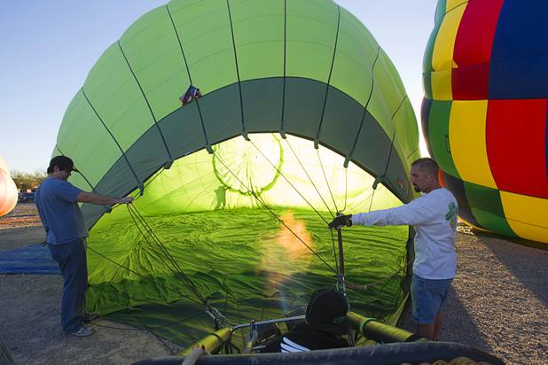Las Vegas Balloon Rides crew members David Casteel, left, and Gary Babin help set up a hot air balloon during the Friends of Metro Search and Rescue Las Vegas Balloon Festival and carnival at the Southern Hills Hospital campus on West Sunset Road Sunday, Nov. 4, 2012.  Festival proceeds from the balloon rides will benefit the nonprofit organization that helps support members of the Las Vegas Police Department Metro Search and Rescue section, many of whom are volunteers.
