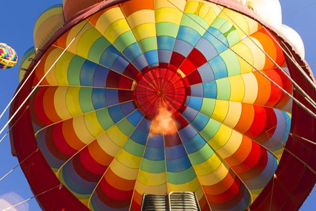 Pilot Dave Lynch of Temecula, Calif. uses propane burners to heat up the air in his ballon during the Friends of Metro Search and Rescue Las Vegas Balloon Festival and carnival at the Southern Hills Hospital campus on West Sunset Road Sunday, Nov. 4, 2012.  Festival proceeds from the balloon rides will benefit the nonprofit organization that helps support members of the Las Vegas Police Department Metro Search and Rescue section, many of whom are volunteers.