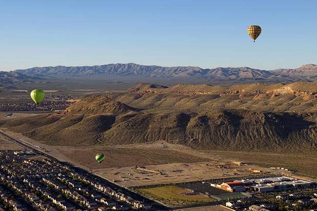 Hot air balloons float over the southwest part of the Las Vegas Valley during the Friends of Metro Search and Rescue Las Vegas Balloon Festival and carnival at the Southern Hills Hospital campus on West Sunset Road Sunday, Nov. 4, 2012.  Festival proceeds from the balloon rides will benefit the nonprofit organization that helps support members of the Las Vegas Police Department Metro Search and Rescue section, many of whom are volunteers.