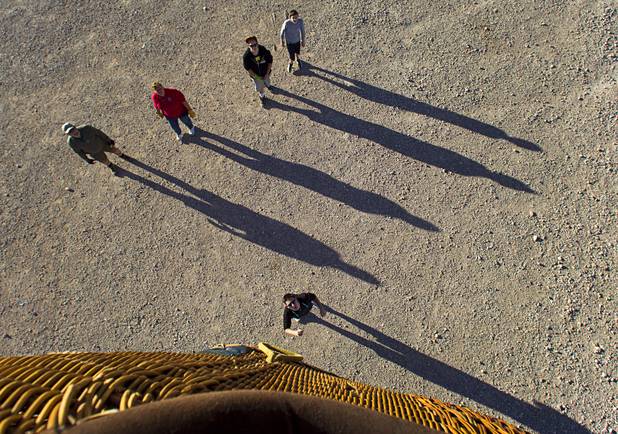Members of Dave Lynch's chase team wait for his hot air ballon to land during the Friends of Metro Search and Rescue Las Vegas Balloon Festival and carnival at the Southern Hills Hospital campus on West Sunset Road Sunday, Nov. 4, 2012.  Festival proceeds from the balloon rides will benefit the nonprofit organization that helps support members of the Las Vegas Police Department Metro Search and Rescue section, many of whom are volunteers.