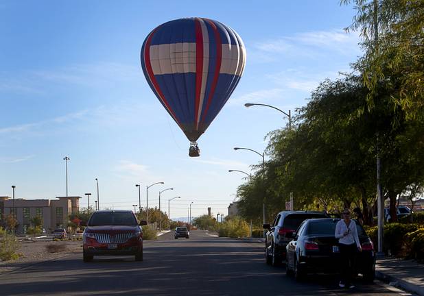 A hot air balloon comes down for a landing during the Friends of Metro Search and Rescue Las Vegas Balloon Festival and carnival at the Southern Hills Hospital campus on West Sunset Road Sunday, Nov. 4, 2012.  Festival proceeds from the balloon rides will benefit the nonprofit organization that helps support members of the Las Vegas Police Department Metro Search and Rescue section, many of whom are volunteers.