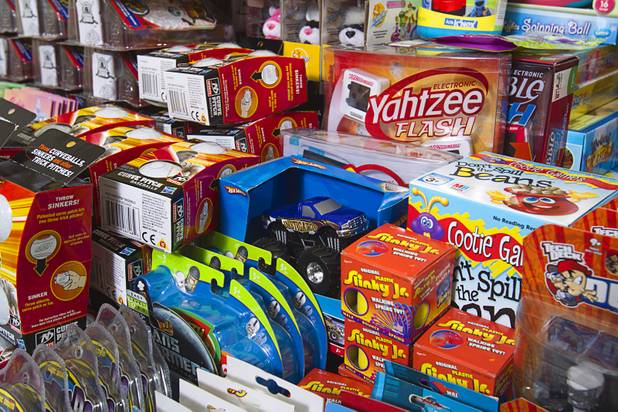 Toys are displayed at Susan England's home Sunday, Nov. 4, 2012. England made a New Year's resolution to collect 100 toys for $100 to donate to the Toys For Tots charity. Then, after she reached the goal, she just kept on going she said.