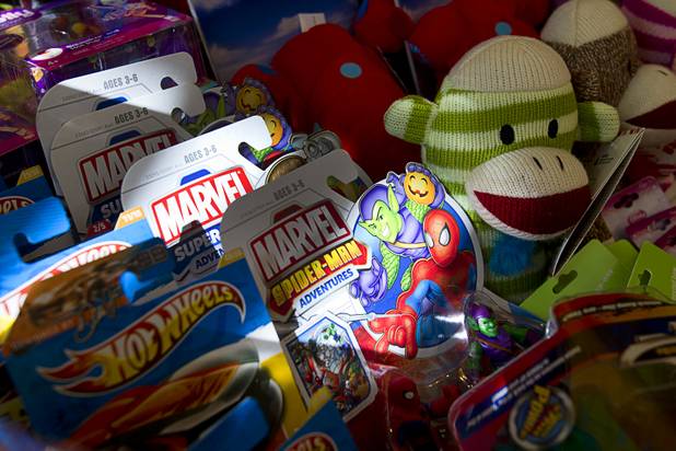 Toys are displayed at Susan England's home Sunday, Nov. 4, 2012. England made a New Year's resolution to collect 100 toys for $100 to donate to the Toys For Tots charity. Then, after she reached the goal, she just kept on going she said.