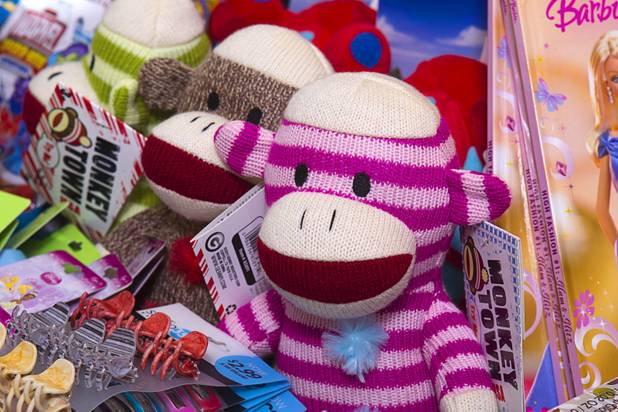 Toys are displayed at Susan England's home Sunday, Nov. 4, 2012. England made a New Year's resolution to collect 100 toys for $100 to donate to the Toys for Tots charity. Then, after she reached the goal, she kept on going.
