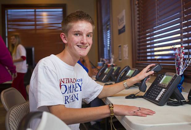 Bond Headlee, 14, a volunteer for the Mitt Romney for President campaign, poses in a Henderson field office Monday, Nov. 5, 2012.