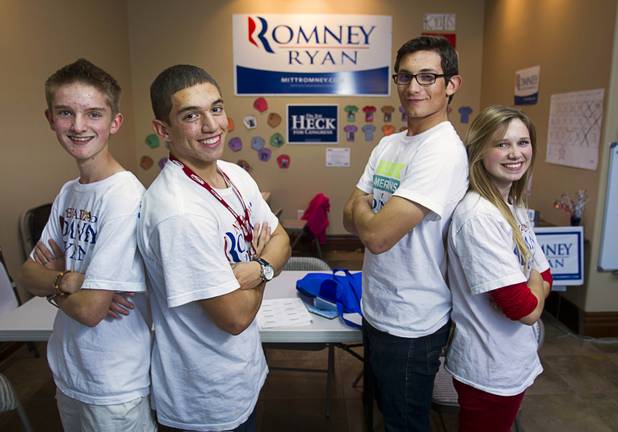 Volunteers for the Mitt Romney for President campaign, from left, Bond Headlee, 14, Tommy Bonetti, 16, Dorian Achaval, 17, and McKenzie Beckstead, 18, pose in a Henderson field office Monday, Nov. 5, 2012.