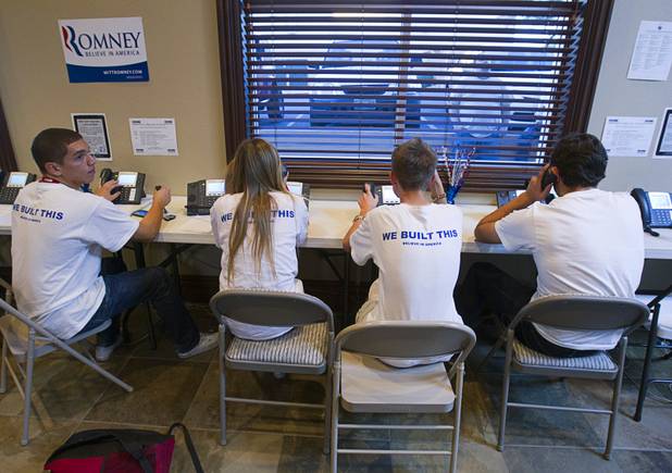 Volunteers for the Mitt Romney for President campaign, from left, Tommy Bonetti, 16,  McKenzie Beckstead, 18, Bond Headlee, 14, and Dorian Achaval, 17, make phone calls in a Henderson field office Monday, Nov. 5, 2012.