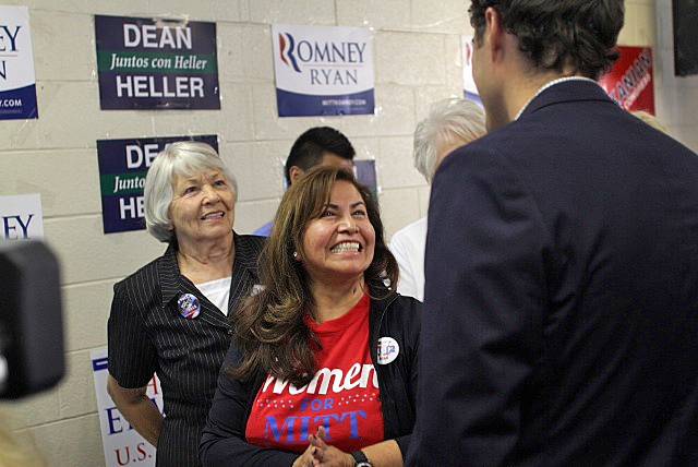 A Mitt Romney campaign volunteer, who works in the east Las Vegas office, greets Craig Romney upon his arrival Monday afternoon. Mitt Romney's youngest son has visited Ohio, Colorado and Nevada in the final days before the election to stump for his father.