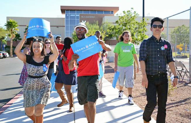 Dante Dumas, center, supports the Obama campaign with fellow UNLV students on campus.
