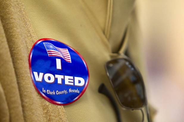 A voter wears her "I Voted" sticker on Election Day at the Cambridge Recreation Center, Tuesday, Nov. 6, 2012.