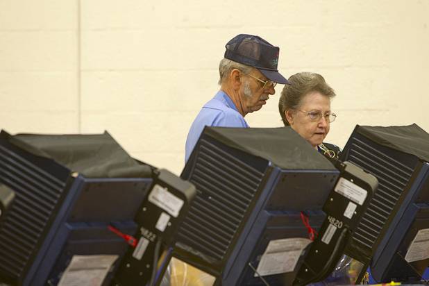 Roy and Patsy Fullmer cast ballots on election day at the Fremont Middle School gym Tuesday, November 6, 2012.