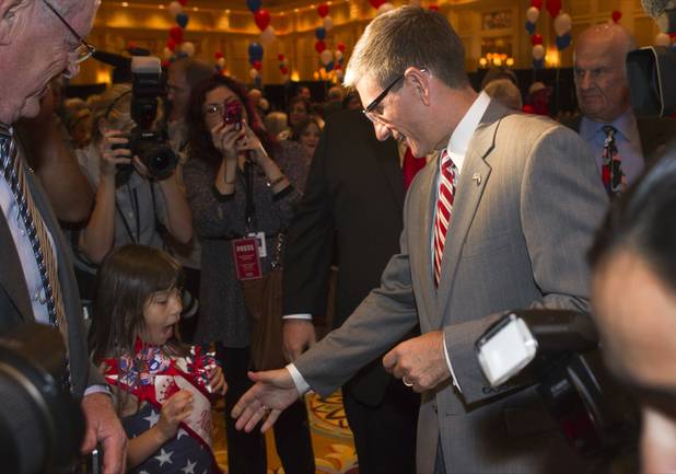 Rep. Joe Heck (R-NV) reaches out to a young supporter during a GOP Election NIght Watch Party at the Venetian Tuesday, November 6, 2012. 
