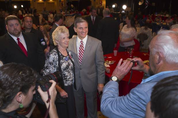 Rep. Joe Heck (R-NV) poses for a photo with a supporter during a GOP Election NIght Watch Party at the Venetian Tuesday, November 6, 2012. 