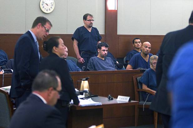 David Schubert, center, the former Clark County prosecutor who was arrested for buying cocaine and then fled to Mexico, appears in court at the Regional Justice Center Wednesday, November 7, 2012.