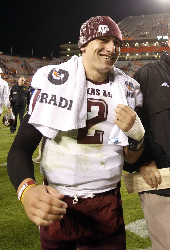 Texas A&M quarterback Johnny Manziel (2) walks off the field after defeating Auburn 63-21 in an NCAA college football game on Saturday, Oct. 27, 2012, in Auburn, Ala.