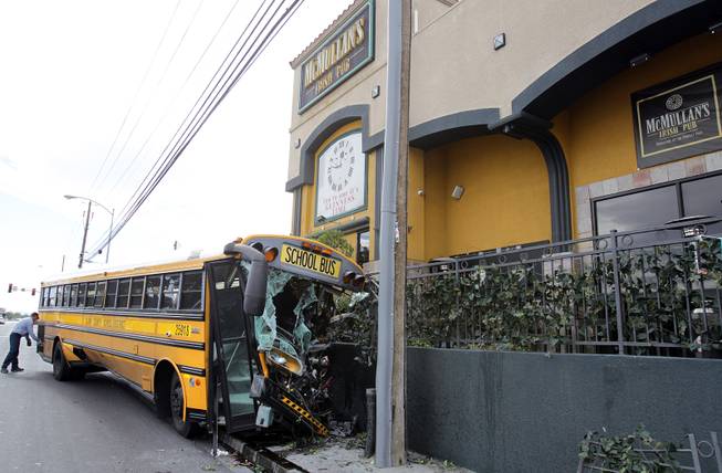 The scene of a school bus crash where only the driver was onboard the bus when it crashed outside of McMullan’s Irish Pub on Tropicana Avenue west of the Orleans on Thursday, November 8, 2012.