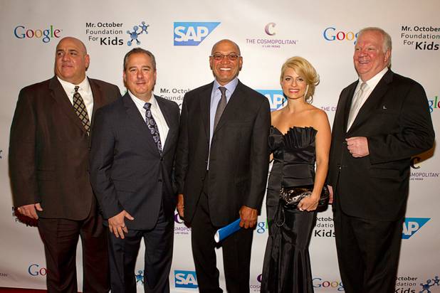 Reggie Jackson, center, poses with guests at the 8th All-Star Celebrity Classic at the Cosmopolitan Sunday, Nov. 11, 2012. From left: Vincent Cortorillo, market manager of gaming and entertainment for Orbitz Worldwide, Doug Gennardo, Cosmopolitan vice president of sales, Austin Bagwell, Cosmopolitan account executive, and Thomas McCartney, Cosmopolitan COO. The event raised funds for the Mr. October Foundation for Kids, a charity that supports minority students pursuing education in science and technology.