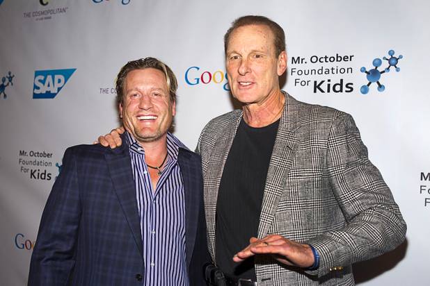 Former NHL player Jeremy Roenick and and former NBA player Rick Barry arrive for Reggie Jackson's 8th All-Star Celebrity Classic at the Cosmopolitan Sunday, Nov. 11, 2012. The event raised funds for the Mr. October Foundation for Kids, a charity that supports minority students pursuing education in science and technology.