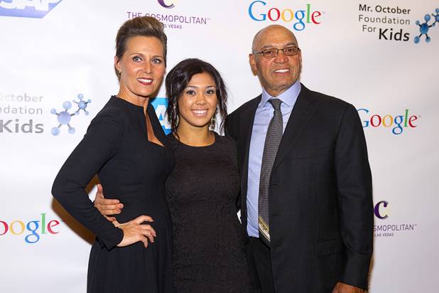 Reggie Jackson, right, poses with family friend Tracy Zeiss, and his daughter Kimberly Jackson at his 8th All-Star Celebrity Classic at the Cosmopolitan Sunday, Nov. 11, 2012. The event raised funds for the Mr. October Foundation for Kids, a charity that supports minority students pursuing education in science and technology.