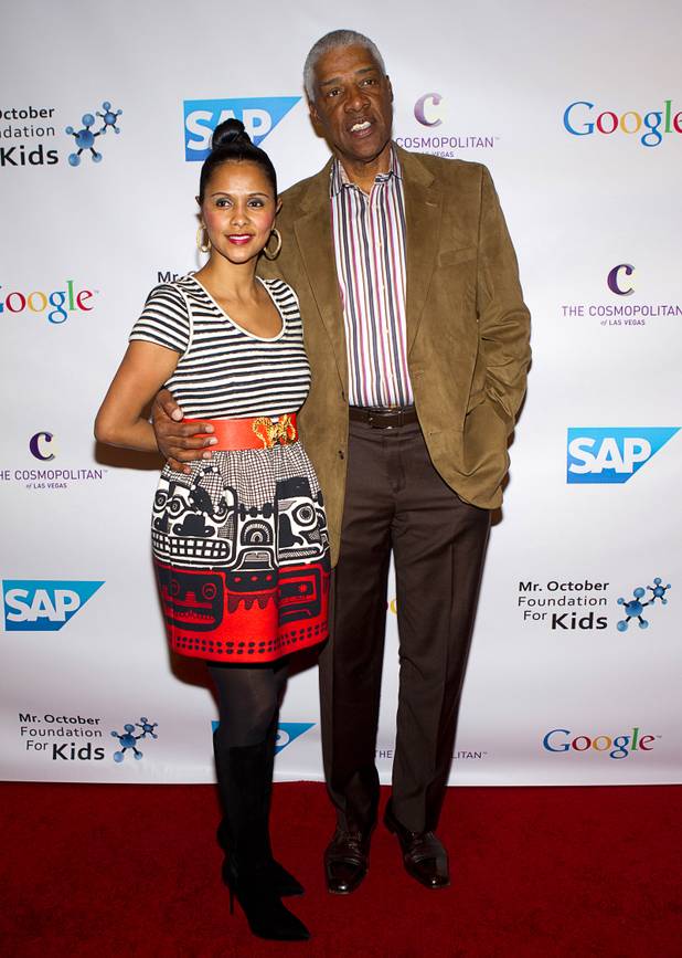 Basketball Hall of Famer Julius "Dr.J" Erving and his wife Dorys arrive for Reggie Jackson's 8th All-Star Celebrity Classic at the Cosmopolitan Sunday, Nov. 11, 2012. The event raised funds for the Mr. October Foundation for Kids, a charity that supports minority students pursuing education in science and technology.