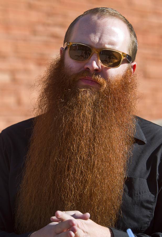 Jack Passion, a two-time world champion in the full natural beard category, watches competitors during the third annual 2012 Beard Team USA National Beard and Moustache Championships at the Clark County Government Center amphitheater in downtown Las Vegas Sunday, November 11, 2012. Passion was not competing in Sunday's event.