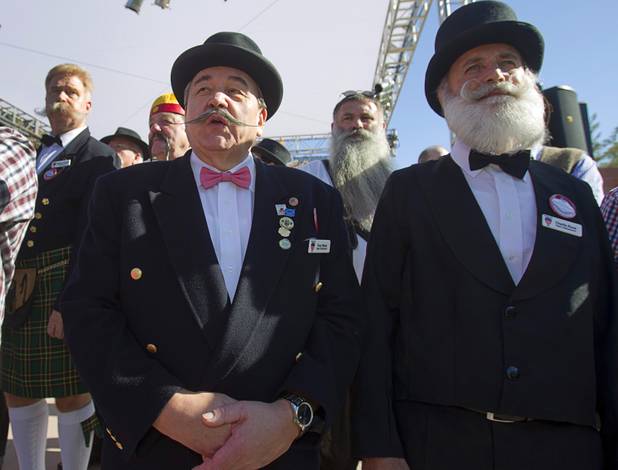 Tony Wyss, left, and Charlie Roos of Switzerland stand during competitor introductions during the third annual 2012 Beard Team USA National Beard and Moustache Championships at the Clark County Government Center amphitheater in downtown Las Vegas Sunday, November 11, 2012.