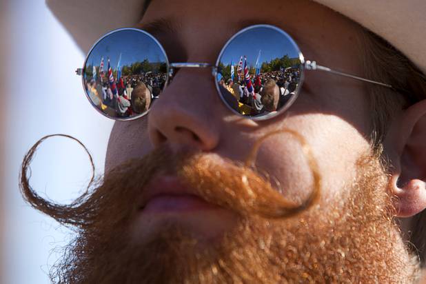 The third annual 2012 Beard Team USA National Beard and Moustache Championships  are reflected in the mirror sunglasses of a competitor at the Clark County Government Center amphitheater in downtown Las Vegas Sunday, November 11, 2012.