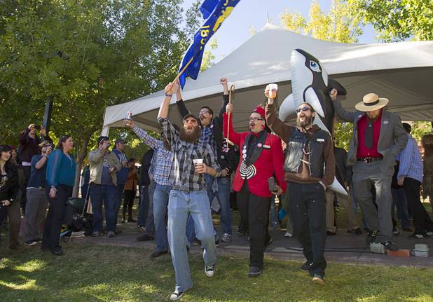 Competitors from Oregon cheer as they are introduced during the third annual 2012 Beard Team USA National Beard and Moustache Championships at the Clark County Government Center amphitheater in downtown Las Vegas Sunday, November 11, 2012.