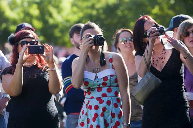 Spectators take photos during competitor introductions in the third annual 2012 Beard Team USA National Beard and Moustache Championships at the Clark County Government Center amphitheater in downtown Las Vegas Sunday, November 11, 2012.