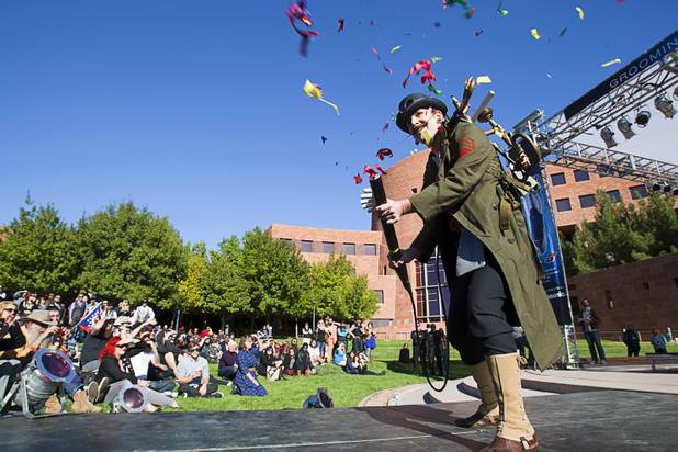 Neill Swift of Fresno , Calif. shoots confetti as he makes an entrance during the third annual 2012 Beard Team USA National Beard and Moustache Championships at the Clark County Government Center amphitheater in downtown Las Vegas Sunday, November 11, 2012. Swift was competing in the English mustache category.