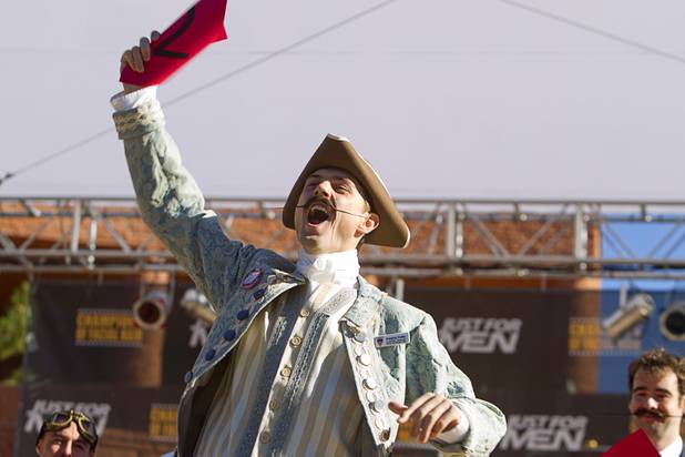 Patrick Fette of Louisville, Kentucky celebrates his first place finish in the English moustache division during the third annual 2012 Beard Team USA National Beard and Moustache Championships at the Clark County Government Center amphitheater in downtown Las Vegas Sunday, November 11, 2012. Fette dressed as a 17th century English nobleman for the competition.